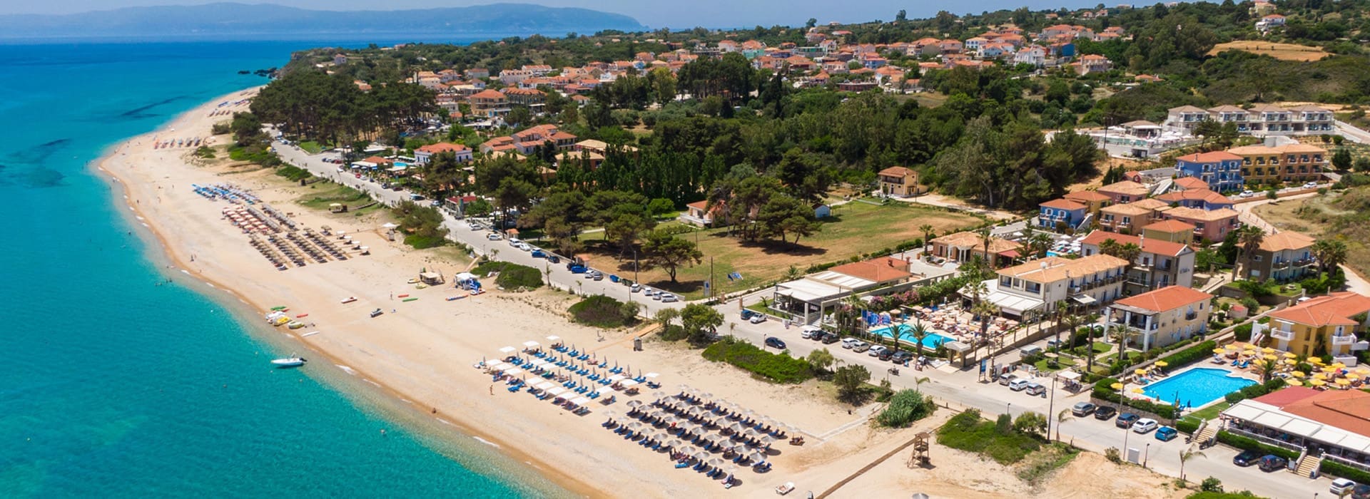 Coastal view near Skala Village Kefalonia with golden sand beach and turquoise water